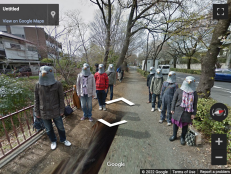 Creepy screenshot from google street view of the pigeon people.